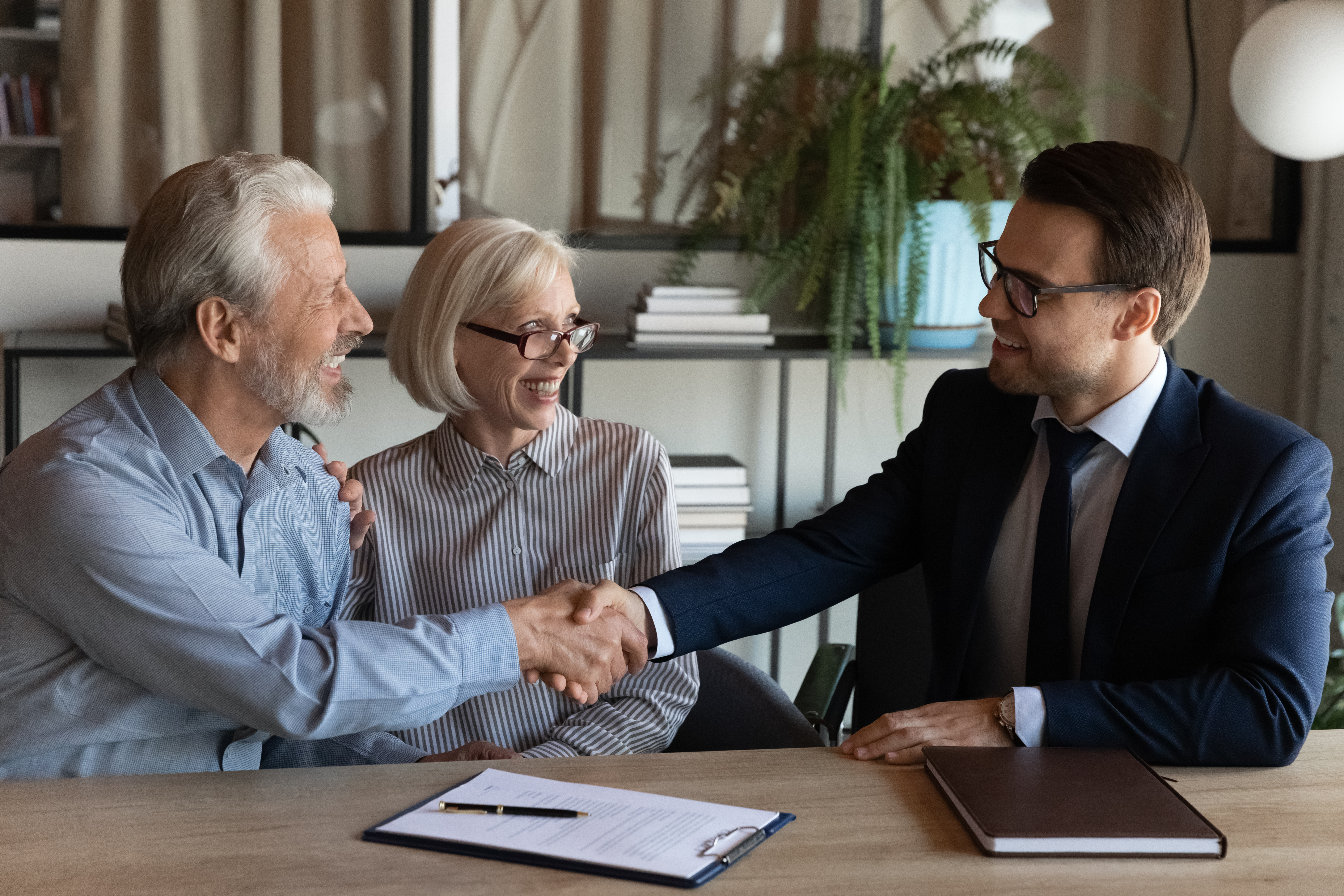 Business owner completing an acquisition deal with advisor — the outcome Signa enables through pre-market intelligence